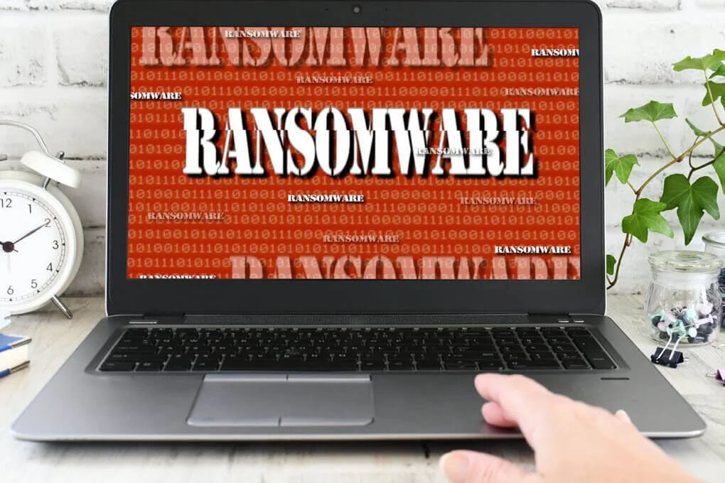 Laptop screen showing a ransomware warning.