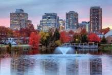 Downtown skyline with a lake and fountain.