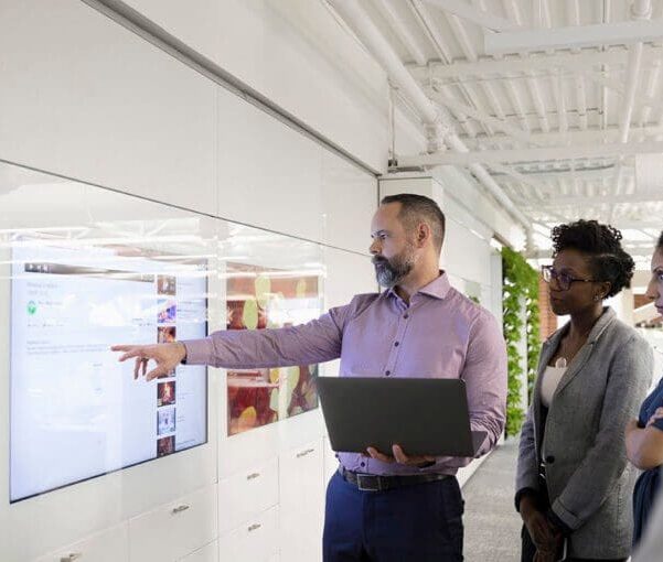 Business meeting with a presentation and laptop.